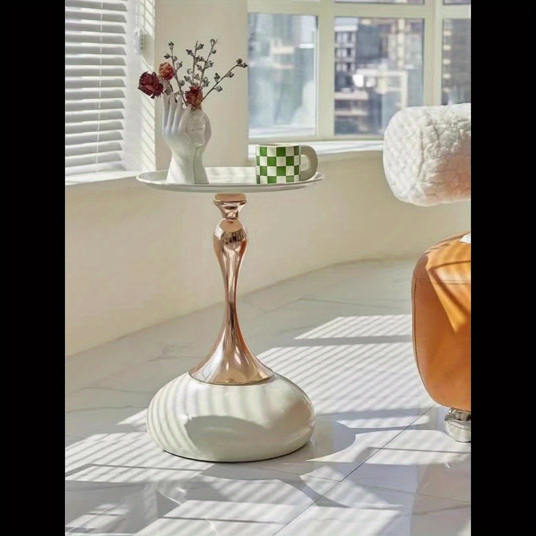 Stylish side table featuring a gold tulip-shaped base