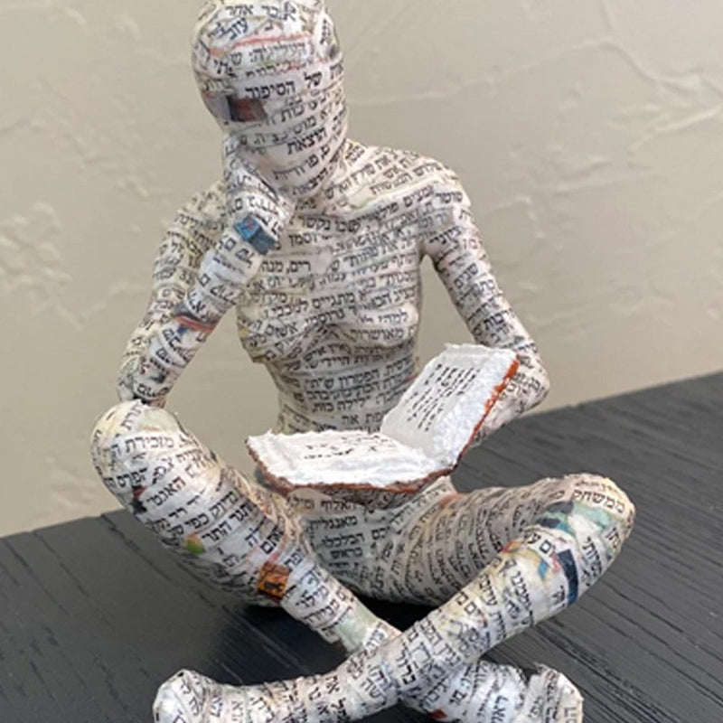 Resin Reading Statue Featuring Newspaper Print Design