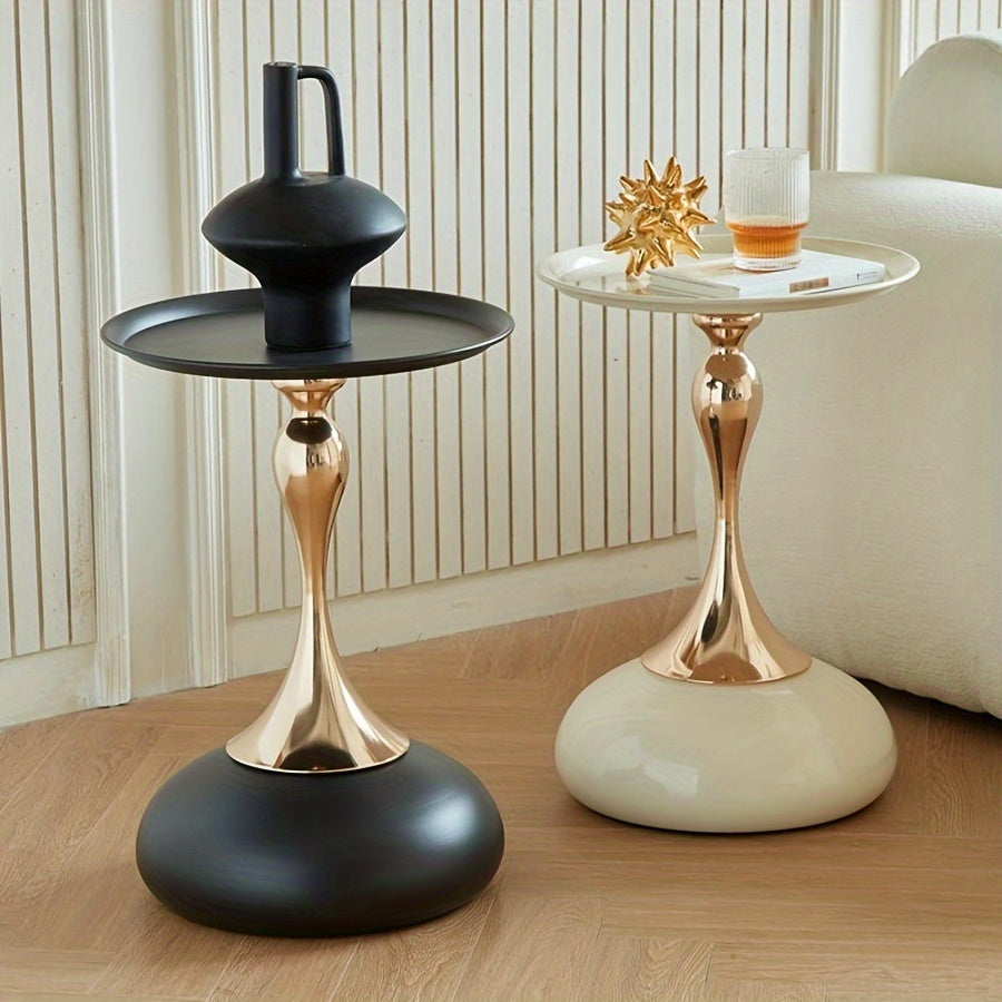 Stylish side table featuring a gold tulip-shaped base