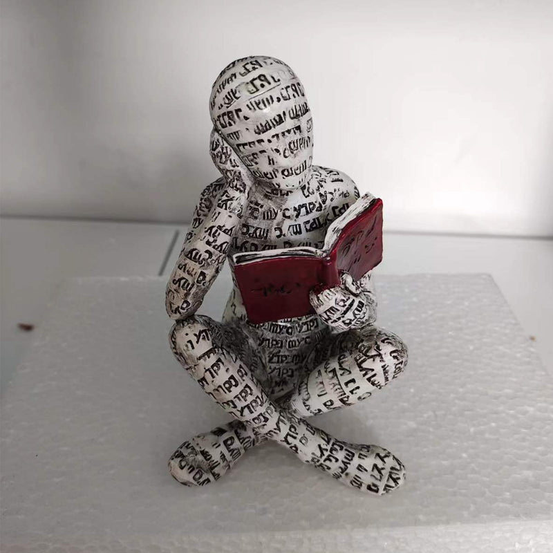 Resin Reading Statue Featuring Newspaper Print Design