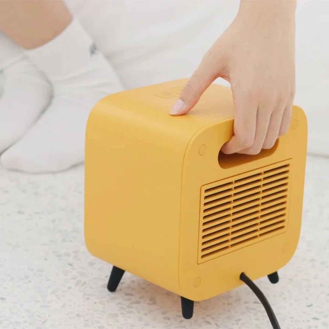 Portable Electric Heater 700W Compact Design with Protective Grille