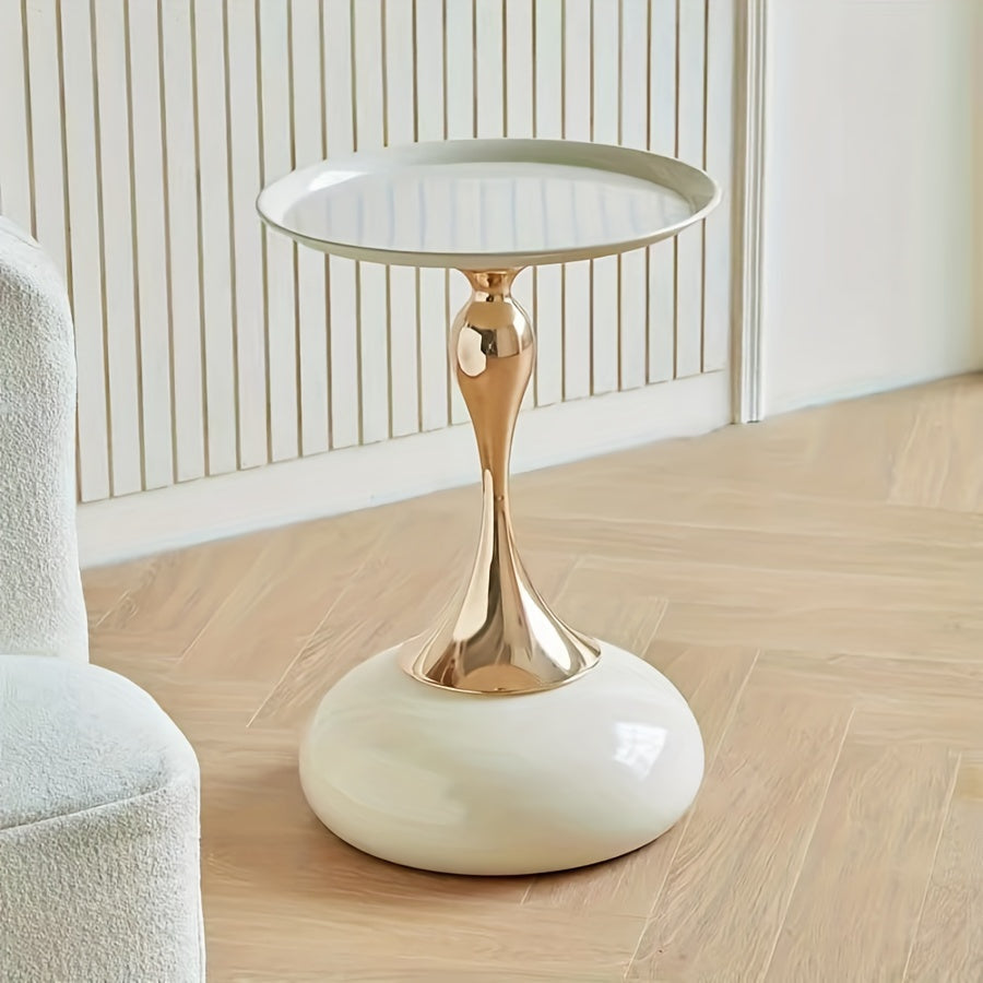 Stylish side table featuring a gold tulip-shaped base