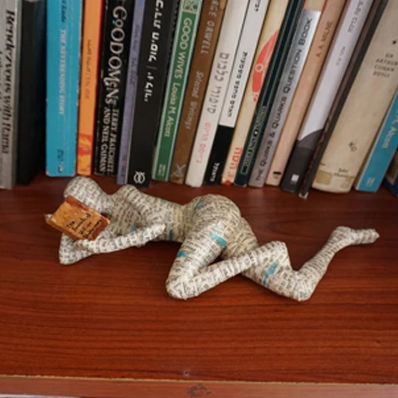 Resin Reading Statue Featuring Newspaper Print Design