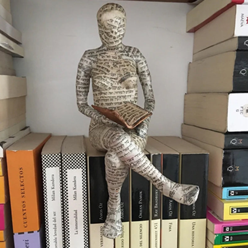 Resin Reading Statue Featuring Newspaper Print Design