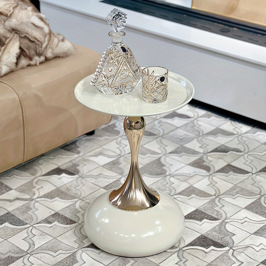 Stylish side table featuring a gold tulip-shaped base
