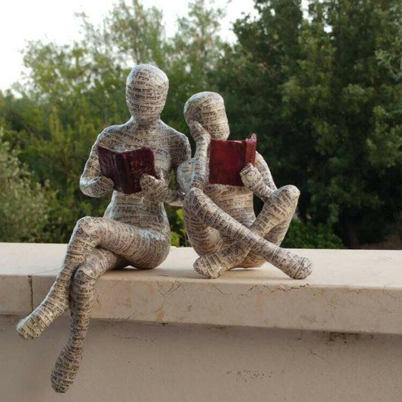 Resin Reading Statue Featuring Newspaper Print Design