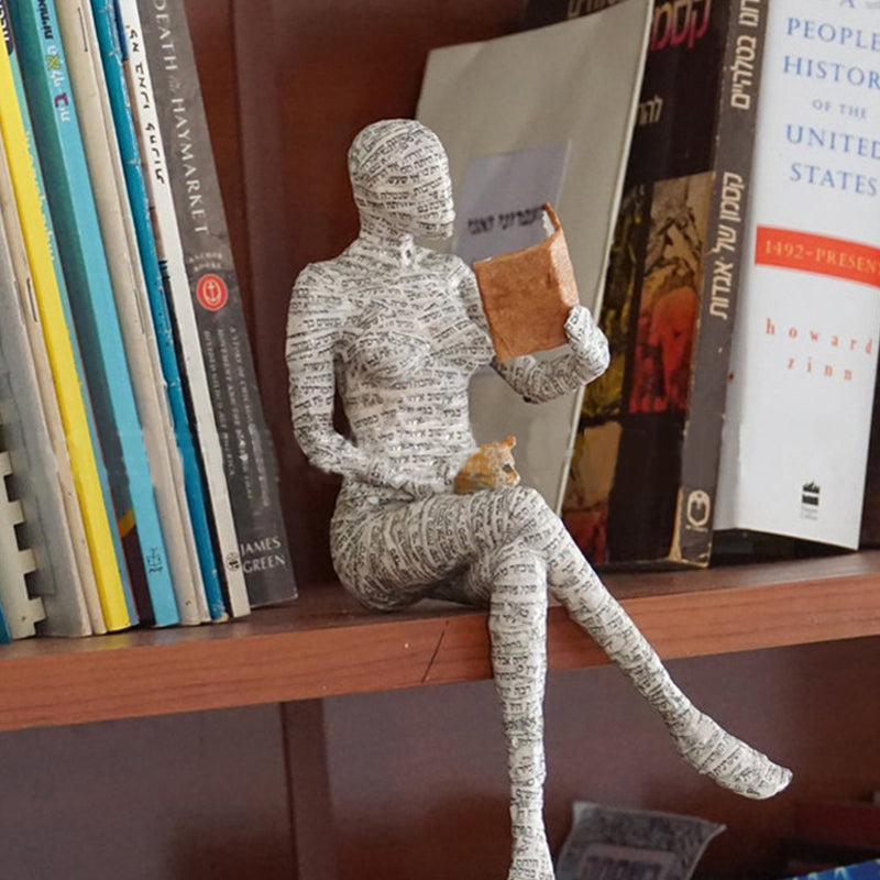 Resin Reading Statue Featuring Newspaper Print Design