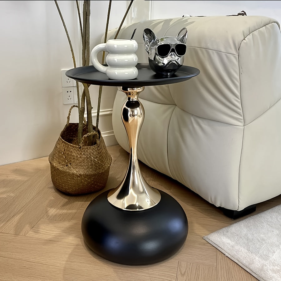 Stylish side table featuring a gold tulip-shaped base