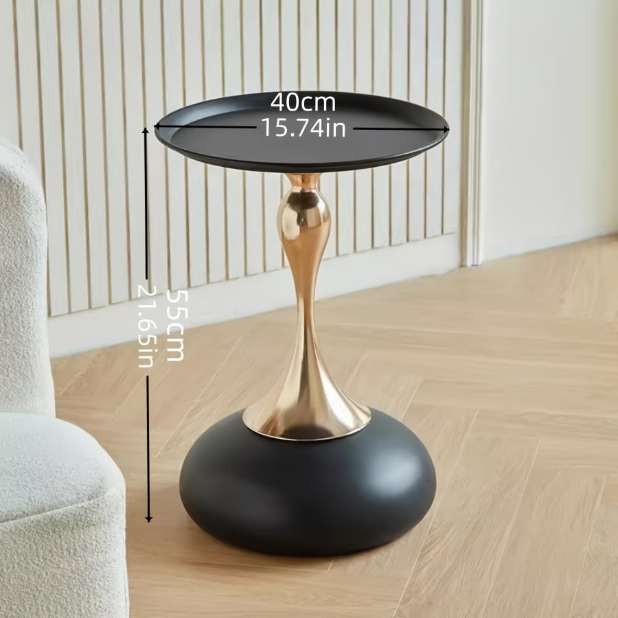 Stylish side table featuring a gold tulip-shaped base