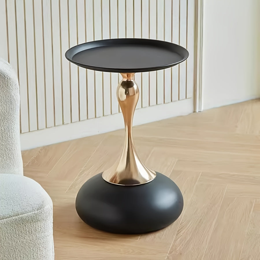 Stylish side table featuring a gold tulip-shaped base