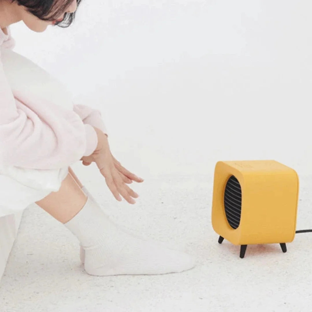 Portable Electric Heater 700W Compact Design with Protective Grille