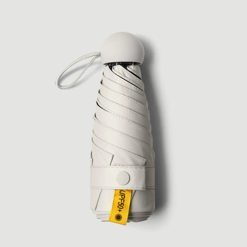 Travel Umbrella Compact Capsule UPF 50+ Wind-Resistant Canopy